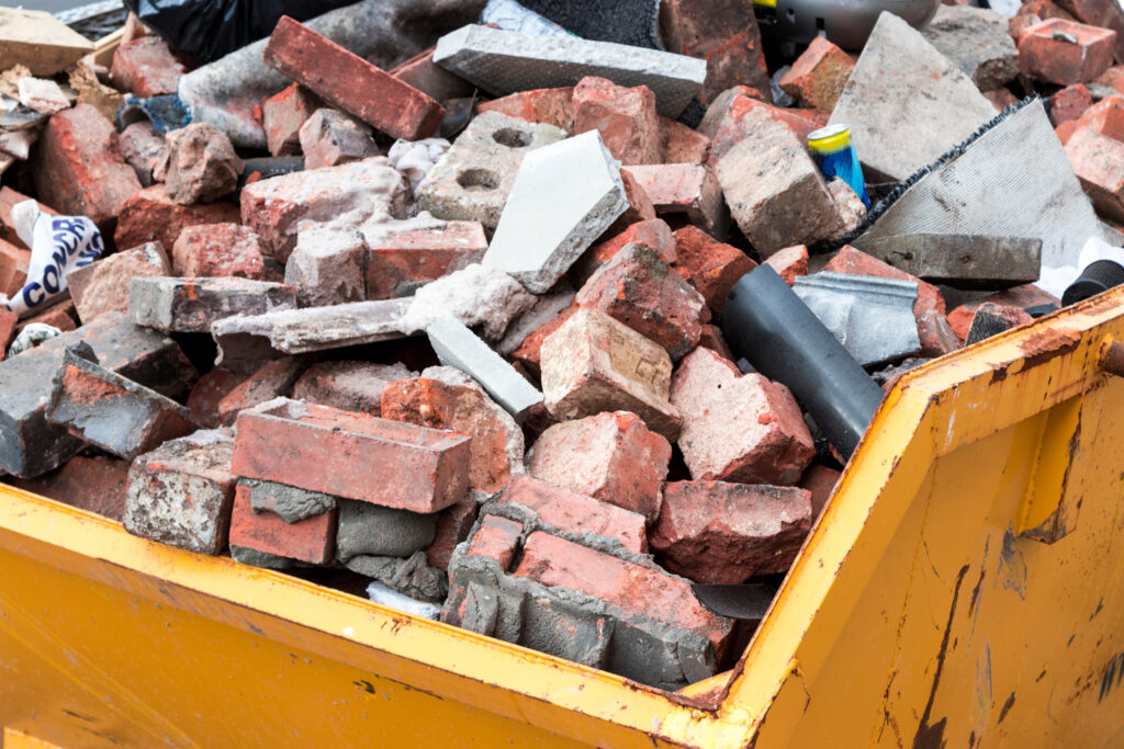 A pile of bricks in a skip