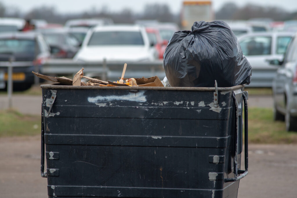 A bin filled with rubbish